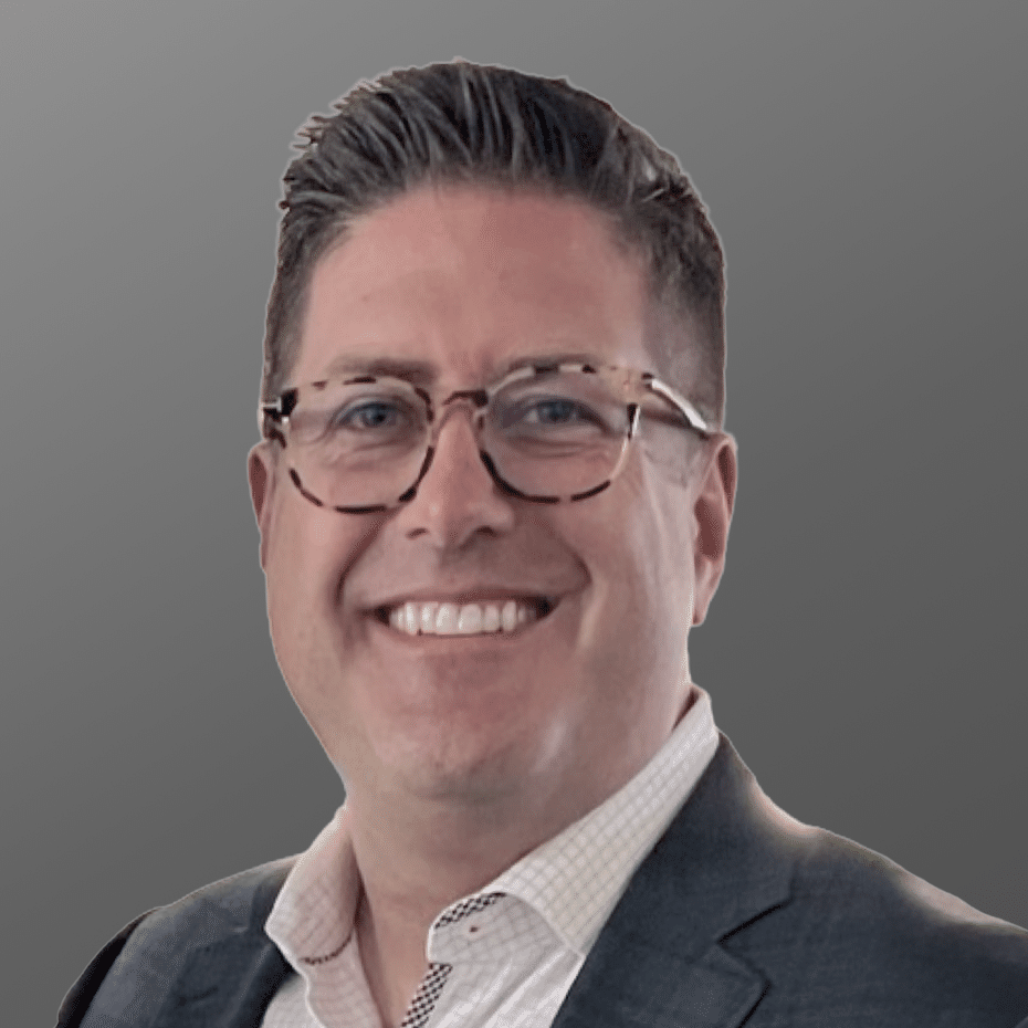 Professional man smiling against a gray background. Astrix is the leading non-human identity (NHI) security platform.